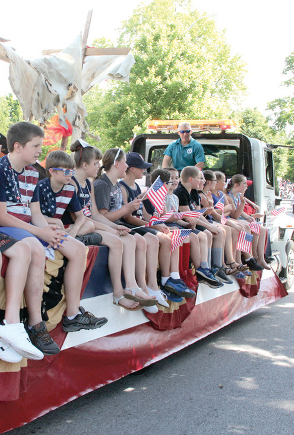 SCHOOL ON THE GO: Hoxsie School students got to experience the parade from the school float.